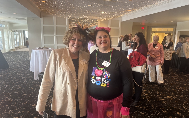Members: Missy Singer and Holly Smith dressed in 80s attire to promote Founder's Day 